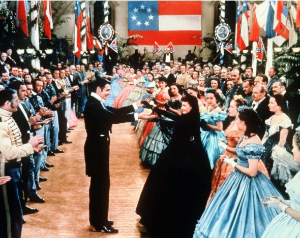 **FILE** Rhett Butler and Scarlett O'Hara are seen dancing in this scene from the movie "Gone With the Wind," in the late 1930s.  The American Civil War saga starring Clark Gable, center, and Vivien Leigh, in black dress,  is the most-watched movie in British history, according to the British Film Institute, Sunday Nov. 28, 2004.(AP Photo/New Line Cinema, File)
